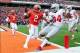 Nov 16, 2013; Champaign, IL, USA; Ohio State Buckeyes running back Carlos Hyde (34) crosses the goal line ahead of Illinois Fighting Illini defensive back V'Angelo Bentley (2) during the first quarter at Memorial Stadium. Mandatory Credit: Bradley Leeb-U