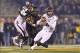 Nov 30, 2013; Columbia, MO, USA; Texas A&M Aggies quarterback Johnny Manziel (2) scrambles away Missouri Tigers defender Michael Sam (52) during the first half at Faurot Field. Mandatory Credit: Peter G. Aiken-USA TODAY Sports