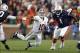 Nov 30, 2013; Auburn, AL, USA; Alabama Crimson Tide quarterback AJ McCarron (10) attempts a shuffle pass against Auburn Tigers defensive tackle Montravius Adams (1) during the second quarter at Jordan Hare Stadium. The pass was incomplete. Mandatory Credi