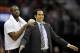 Nov 27, 2013; Cleveland, OH, USA; Miami Heat shooting guard Dwyane Wade (left) stands behind head coach Erik Spoelstra after Spoelstra was called for a technical foul in the second quarter against the Cleveland Cavaliers at Quicken Loans Arena. Mandatory