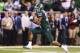 INDIANAPOLIS, IN - DECEMBER 07: Jeremy Langford #33 of the Michigan State Spartans out runs the defense of the Ohio State Buckeyes to score the game winning touchdown in the fourth quarter of the Big Ten Conference Championship game at Lucas Oil Stadium