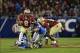 Dec 7, 2013; Charlotte, NC, USA; Florida State Seminoles running back Devonta Freeman (8) runs as offensive linesman Tre' Jackson (54) looks on and Duke Blue Devils nose tackle Jamal Bruce (91) and linebacker Kelby Brown (59) defend at Bank of America Sta