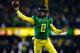EUGENE, OR - NOVEMBER 29: Quarterback Marcus Mariota #8 of the Oregon Ducks throws a pass against the Oregon State Beavers during the 117th playing of the Civil War on November 29, 2013 at the Autzen Stadium in Eugene, Oregon. (Photo by Jonathan Ferrey/