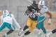 PITTSBURGH, PA - DECEMBER 08: Le'Veon Bell #26 of the Pittsburgh Steelers makes a move on Dimitri Patterson #24 of the Miami Dolphins in the first quarter at Heinz Field on December 8, 2013 in Pittsburgh, Pennsylvania. (Photo by Gregory Shamus/Getty Imag