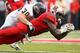 PISCATAWAY, NJ - OCTOBER 27: Brandon Coleman #17 of the Rutgers Scarlet Knights is tackled by Luke Batton #30 of the Kent State Golden Flashes after making a catch at High Point Solutions Stadium on October 27, 2012 in Piscataway, New Jersey. (Photo by A
