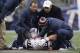 Dec 8, 2013; Foxborough, MA, USA; Medical staff attend to New England Patriots tight end Rob Gronkowski (87) after he was injured by a Cleveland Browns player during the third quarter at Gillette Stadium. Mandatory Credit: Stew Milne-USA TODAY Sports