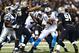 NEW ORLEANS, LA - DECEMBER 8: Cam Newton #1 of the Carolina Panthers is sacked during a game against the New Orleans Saints at Mercedes-Benz Superdome on December 8, 2013 in New Orleans, Louisiana. (Photo by Wesley Hitt/Getty Images)