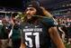 Dec 7, 2013; Indianapolis, IN, USA; Michigan State Spartans offensive tackle Fou Fonoti (51) holds a rose in his mouth after defeating the Ohio State Buckeyes in the Big 10 Championship game at Lucas Oil Stadium. Michigan State defeats Ohio State 34-24.