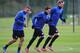 ST ALBANS, ENGLAND - NOVEMBER 25: Lukas Podolski, Mesut Ozil and Per Mertesacker of Arsenal warm up during a training session at London Colney on November 25, 2013 in St Albans, England. (Photo by Shaun Botterill/Getty Images)