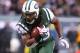 Dec 8, 2013; East Rutherford, NJ, USA; New York Jets running back Chris Ivory (33) runs for a 4th quarter touchdown during their game against the Oakland Raiders at MetLife Stadium. The Jets defeated the Raiders 37-27. Mandatory Credit: Ed Mulholland-USA