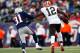 FOXBORO, MA - DECEMBER 08: Josh Gordon #12 of the Cleveland Browns stiff arms Aqib Talib #31 of the New England Patriots on his way to the endzone in the second half during the game at Gillette Stadium on December 8, 2013 in Foxboro, Massachusetts. (Phot