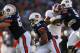AUBURN, AL - NOVEMBER 30: Tre Mason #21 of the Auburn Tigers carries the ball against the Alabama Crimson Tide in the first quarter at Jordan-Hare Stadium on November 30, 2013 in Auburn, Alabama. (Photo by Kevin C. Cox/Getty Images)