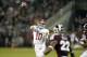 Nov 16, 2013; Starkville, MS, USA; Alabama Crimson Tide quarterback A.J. McCarron (10) rolls out passing against the Mississippi State Bulldogs during the first quarter at Davis Wade Stadium. Mandatory Credit: John David Mercer-USA TODAY Sports
