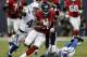 HOUSTON, TX - NOVEMBER 03: Andre Johnson #80 of the Houston Texans breaks loose from the tackle attempt of Antoine Bethea #41 of the Indianapolis Colts and LaRon Landry #30 at Reliant Stadium on November 3, 2013 in Houston, Texas. (Photo by Bob Levey/Gett