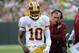 Sep 15, 2013; Green Bay, WI, USA; Washington Redskins quarterback Robert Griffin III (10) and head coach Mike Shanahan walk on the sidelines during the game against the Green Bay Packers in the third quarter at Lambeau Field. Mandatory Credit: Benny Sieu