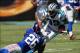 Sep 22, 2013; Charlotte, NC, USA; Carolina Panthers wide receiver Steve Smith (89) gets tackled by New York Giants strong safety Antrel Rolle (26) during the second quarter at Bank of America Stadium. Mandatory Credit: Jeremy Brevard-USA TODAY Sports