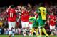 LONDON, ENGLAND - OCTOBER 19: Mesut Oezil of Arsenal (11) celebrates with Mikel Arteta as he scores their fourth goal during the Barclays Premier League match between Arsenal and Norwich City at Emirates Stadium on October 19, 2013 in London, England. (
