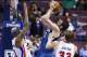 Dec 10, 2013; Auburn Hills, MI, USA; Minnesota Timberwolves power forward Kevin Love (42) shoots over Detroit Pistons power forward Charlie Villanueva (31) and power forward Jonas Jerebko (33) in the third quarter at The Palace of Auburn Hills. Minnesota