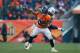DENVER, CO - DECEMBER 8: Running back Knowshon Moreno #27 of the Denver Broncos is wrapped up and tackled by strong safety Bernard Pollard #31 of the Tennessee Titans during a game at Sports Authority Field Field at Mile High on December 8, 2013 in Denv