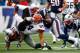 FOXBORO, MA - DECEMBER 08: Jordan Cameron #84 of the Cleveland Browns is upended by Kyle Arrington #25 and Jamie Collins #91 of the New England Patriots after catching a pass in the first quarter during the game at Gillette Stadium on December 8, 2013 in