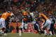 DENVER, CO - DECEMBER 12: Quarterback Peyton Manning #18 of the Denver Broncos is hit by defensive end Corey Liuget #94 of the San Diego Chargers as he throws a pass during a game at Sports Authority Field Field at Mile High on December 12, 2013 in Denve