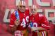 SAN FRANCISCO, CA - DECEMBER 08: San Francisco 49ers fans 'The Helmet Heads' Paul Maldonado (L) and Marcus Sperry (R) from Sacramento, Ca enjoys a beer prior to the start of an NFL football game between the Seattle Seahawks and 49ers at Candlestick Park