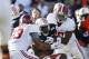 AUBURN, AL - NOVEMBER 30: Ricardo Louis #5 of the Auburn Tigers is tackled by Trey DePriest #33 and Jarrick Williams #20 of the Alabama Crimson Tide in the first half at Jordan-Hare Stadium on November 30, 2013 in Auburn, Alabama. (Photo by Kevin C. Cox