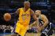 Dec 13, 2013; Oklahoma City, OK, USA; Los Angeles Lakers shooting guard Kobe Bryant (24) dribbles the ball around Oklahoma City Thunder point guard Derek Fisher (6) during the second quarter at Chesapeake Energy Arena. Mandatory Credit: Mark D. Smith-USA