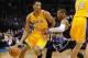 Dec 13, 2013; Oklahoma City, OK, USA; Los Angeles Lakers shooting guard Wesley Johnson (11) dribbles the ball around Oklahoma City Thunder point guard Russell Westbrook (0) during the first quarter at Chesapeake Energy Arena. Mandatory Credit: Mark D. Smi