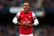 MANCHESTER, ENGLAND - DECEMBER 14: Theo Walcott of Arsenal celebrates scoring their first goal during the Barclays Premier League match between Manchester City and Arsenal at Etihad Stadium on December 14, 2013 in Manchester, England. (Photo by Clive Br