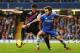 LONDON, ENGLAND - DECEMBER 14: (L-R) Joel Ward of Crystal Palace and Juan Mata of Chelsea challenge for the ball during the Barclays Premier League match between Chelsea and Crystal Palace at Stamford Bridge on December 14, 2013 in London, England. (Pho