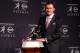 NEW YORK, NY - DECEMBER 08: Quarterback Johnny Manziel of the Texas A&M University Aggies poses with the Heisman Memorial Trophy after being named the 78th Heisman Memorial Trophy Award winner at a press conference after at the Marriott Marquis on Decemb