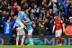 MANCHESTER, ENGLAND - DECEMBER 14: A dejected Jack Wilshere of Arsenal walks as David Silva, Pablo Zabaleta of Manchester City celebrate with Alvaro Negredo of Manchester City after he scored their second goal during the Barclays Premier League match betw