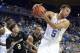 Nov 12, 2013; Los Angeles, CA, USA; UCLA Bruins guard/forward Kyle Anderson (5) pulls in a rebound against Oakland Golden Grizzlies forward Dante Williams (2) during the first half at Pauley Pavilion. Mandatory Credit: Richard Mackson-USA TODAY Sports