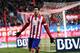 MADRID, SPAIN - DECEMBER 15: Diego Costa of Club Atletico de Madrid celebrates after scoring Atletico's 3rd goal during the La Liga match between Club Atletico de Madrid and Valencia CF at Vicente Calderon Stadium on December 15, 2013 in Madrid, Spain.