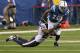 Dec 15, 2013; Indianapolis, IN, USA; Indianapolis Colts wide receiver T.Y. Hilton (13) catches a pass and is tackled by Houston Texans cornerback Johnathan Joseph (24) during the first quarter at Lucas Oil Stadium. Mandatory Credit: Pat Lovell-USA TODAY S