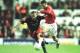 23 Oct 2001: Ryan Giggs of United holds off Dimitrios Mavrogenidis of Olympiakos during the match between Manchester United and Olympiakos in the Champions League Group G at Old Trafford, Manchester. Mandatory Credit: Ben Radford/ALLSPORT