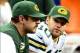 Nov 28, 2013; Detroit, MI, USA; Green Bay Packers quarterback Aaron Rodgers (left) sits on the bench next to quarterback Matt Flynn (10) during the fourth quarter of a NFL football game against the Detroit Lions on Thanksgiving at Ford Field. Mandatory Cr