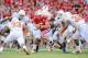 LINCOLN, NE - OCTOBER 16: Quarterback Zac Lee #5 of the Nebraska Cornhuskers prepares to get hit by linebacker Jordan Hicks #33 and defensive end Eddie Jones #32 of the Texas Longhorns during their game at Memorial Stadium on October 16, 2010 in Lincoln,