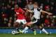 MANCHESTER, ENGLAND - OCTOBER 29: Ashley Young of Manchester United attempts to move away from Steven Whittaker of Norwich City during the Capital One Cup Fourth Round match between Manchester United and Norwich City at Old Trafford on October 29, 2013 i