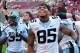 Nov 2, 2013; Raleigh, NC, USA; North Carolina Tar Heels tight end Eric Ebron (85) and safety Damien Washington (35) celebrate a victory against the North Carolina State Wolfpackat Carter Finley Stadium. North Carolina beat North Carolina State 27-19.