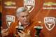 AUSTIN, TX - DECEMBER 15: University of Texas head football coach Mack Brown speaks at a press conference December 15, 2013 in Austin, Texas. Brown announced that he will step down as coach after the Valero Alamo Bowl game against Oregon on December 30. (