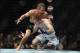 December 14, 2013; Sacramento, CA, USA; Urijah Faber (red gloves) fights Michael McDonald (blue gloves) during the bantamweight bout of the UFC on FOX 9 at Sleep Train Arena. Mandatory Credit: Kyle Terada-USA TODAY Sports
