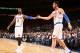 NEW YORK, NY - DECEMBER 6: J.R. Smith #8 of the New York Knicks high fives teammate Andrea Bargnani #77 of the New York Knicks during a game against the Orlando Magic at Madison Square Garden in New York City on December 6, 2013. NOTE TO USER: User expre