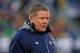 SOUTH BEND, IN - NOVEMBER 02: Head coach Brian Kelly of the Notre Dame Fighting Irish walks off of the field after checking on an injured player during a game against the Navy Midshipmen at Notre Dame Stadium on November 2, 2013 in South Bend, Indiana. N