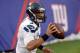 Dec 15, 2013; East Rutherford, NJ, USA; Seattle Seahawks quarterback Russell Wilson (3) holds the ball after running out of bounds against the New York Giants during the second half at MetLife Stadium. Mandatory Credit: Joe Camporeale-USA TODAY Sports