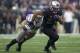 SEATTLE, WA - NOVEMBER 29: Bishop Sankey #25 of Washington rushes the ball as Tana Pritchard #33 of Washington State tries to make a tackle during the second half of a game at Husky Stadium on November 29, 2013 in Seattle, Washington. Washington won the g
