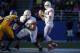 SAN JOSE, CA - NOVEMBER 29: Quarterback Derek Carr #4 of the Fresno State Bulldogs takes a snap against the San Jose State Spartans defense in the second quarter on November 29, 2013 at Spartan Stadium in San Jose, California. (Photo by Brian Bahr/Getty