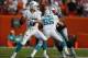 Dec 15, 2013; Miami Gardens, FL, USA: Miami Dolphins quarterback Ryan Tannehill (17) prepares to throw the ball as guard Sam Brenner (65) blocks New England Patriots defensive tackle Sealver Siliga (71) in the second half at Sun Life Stadium. The Dolphins