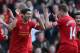 LIVERPOOL, ENGLAND - DECEMBER 21: Luis Suarez of Liverpool celebrates after scoring his second goal with team mate Jordan Henderson during the Barclays Premier League match between Liverpool and Cardiff City at Anfield at Anfield on December 21, 2013 in